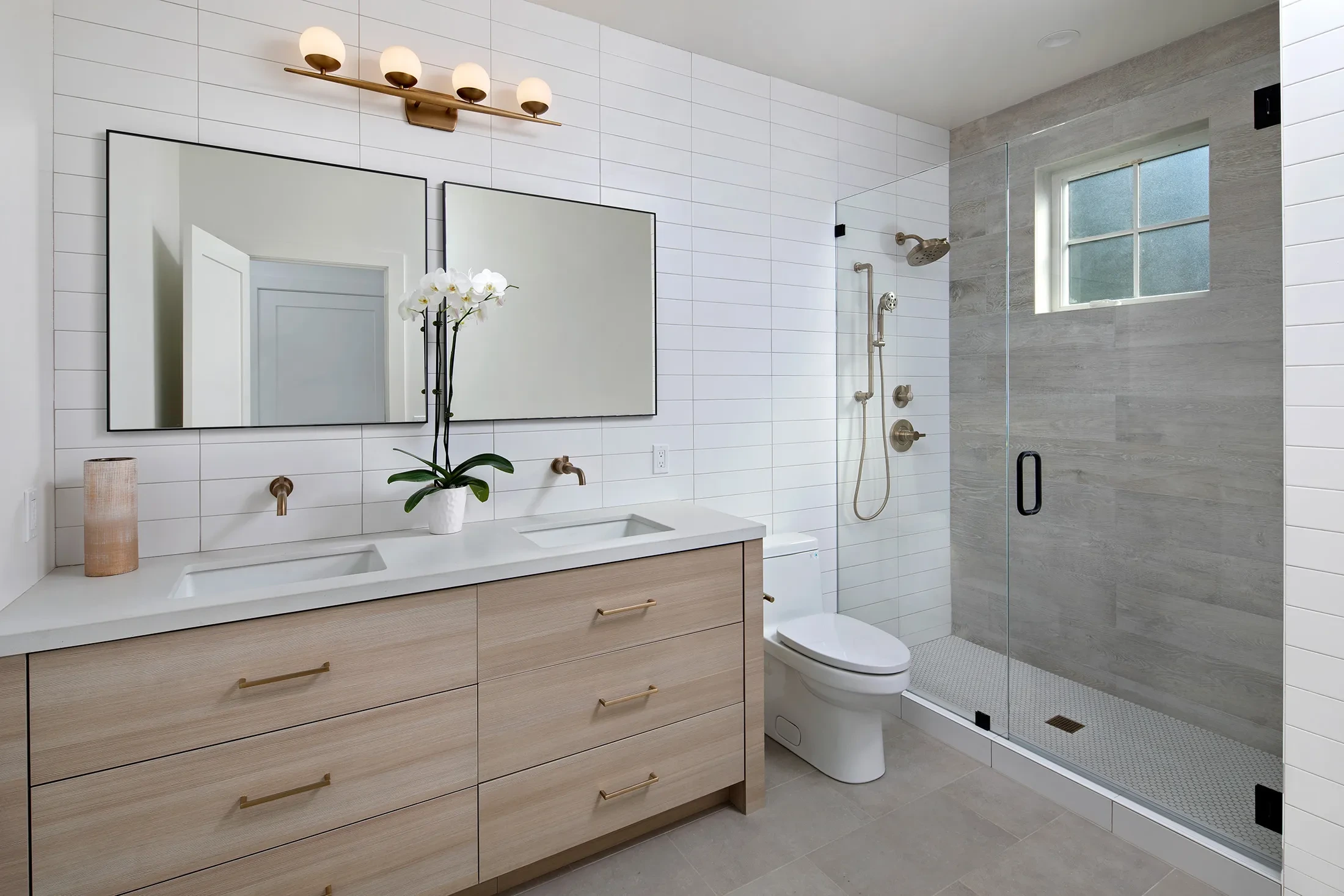 Live Oak by GHG Builders — bathroom with walk-in shower and floating vanity