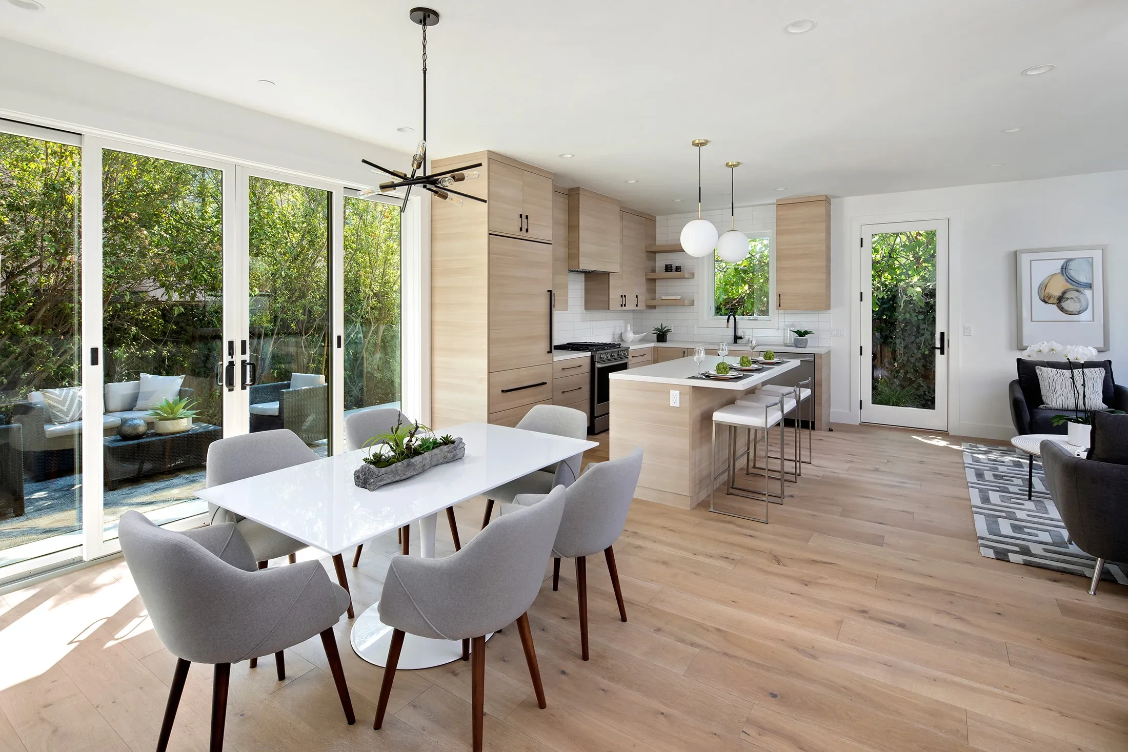 Live Oak by GHG Builders — dining room with the kitchen beyond