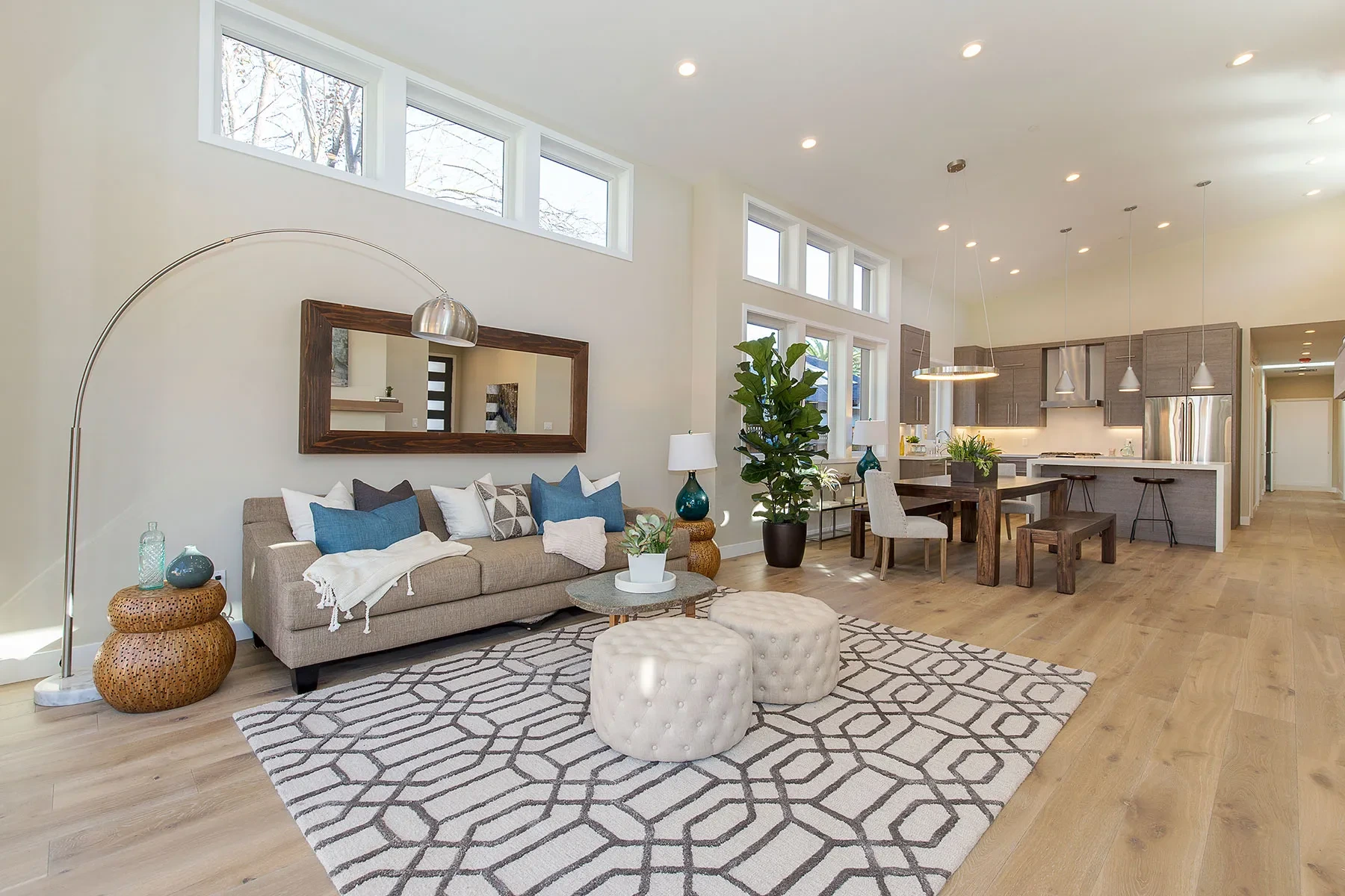 O'Keefe by GHG Builders — living room with patterned rug and open plan dining