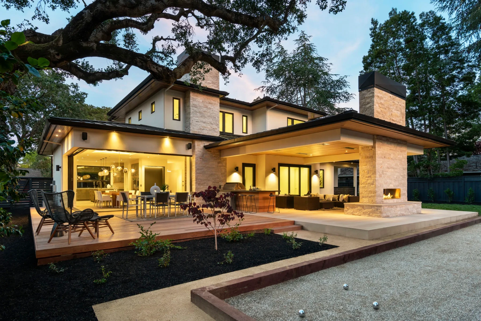 Pineview by GHG Builders — patio and indoor-outdoor living at dusk
